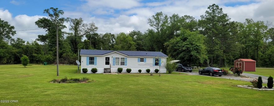 Don't miss out on this opportunity to own a large lot that is 1.57 acres in Marianna. This spacious mobile home consists of 3 bedrooms and 2 baths. New roof placed in 2019. The main bedroom is complete with en-suite bathroom with garden tub. All bedrooms have walk-in closets. Exterior is vinyl siding . Also on property is utility shed as well as carport. All measurements to be verified by buyer.