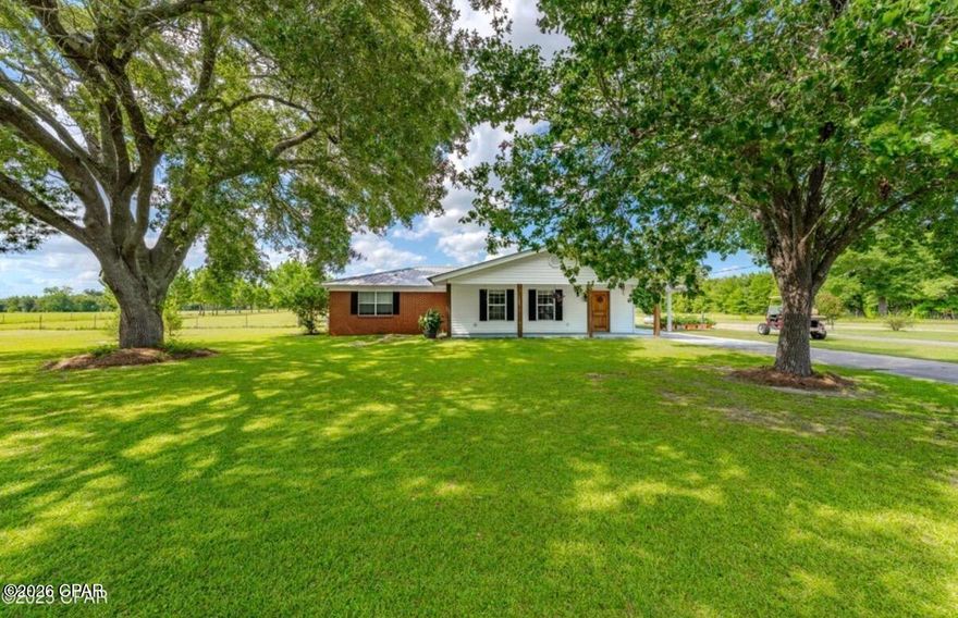 Welcome to this newly renovated, charming 3 bedroom, 2 bathroom home nestled on over 5 acres of high, dry, and flat land in the desirable Dellwood area, just off Blue Springs Rd and Hwy 69-the perfect location for peaceful country living with easy access to town! Step inside to find a massive living area and an open kitchen that's perfect for entertaining or relaxing with the family. The primary bedroom suite is a true retreat with a gigantic closet and bathroom that feels more like a luxury escape. Enjoy evenings on the screened porch under the shade of mature trees, or take advantage of the large attached shop with roll-up door-perfect for tools, toys, or projects. Need extra space? There's an attached bonus family/playroom complete with a second full-size kitchen-ideal for hosting, multi-generational living, or even your dream hobby space. Just behind the home is a beautiful above ground pool with deck built just for this pool. This is the Dellwood property you've been waiting for-privacy, functionality, and room to grow.