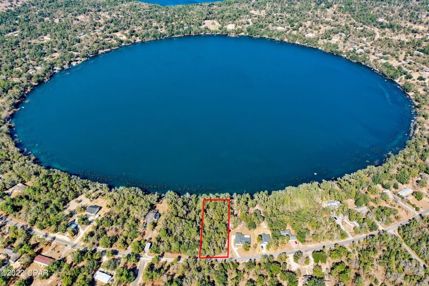 Looking for the perfect Lakefront property to build your dream home? Check out this waterfront lot on beautiful Leisure Lake located less than 30 minutes from Lynn Haven. This is one of the cleanest lakes in northwest Florida. The water is so clear that fishermen must use light fishing line to catch fish because they can see it. This lot is on the south side of the lake so it is a good spot to view the daily sunsets. Park your boat, kayak or paddle board at the water's edge for easy access. Enjoy amenities such as a swimming pool, rental kitchen at the pavilion, basketball court, tennis court, men's and women's restrooms, boat launch, toddler playground and more. There is also a second lake with a boat launch.  Call your Realtor today.