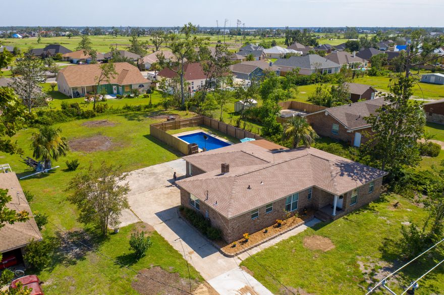 If you are looking for a beautiful 4/3 home, on half an acre w/a BIG in-ground pool, right in the heart of Lynn Haven, look no further! But, at $121 a sq ft, it won't last long! Located right outside the Country Club, this home has received lots of upgrades, to include gorgeous plantation shutters throughout!  Entering the home, you will see the stunning 20 x 20 marble tile that has been laid throughout the hallways, kitchen, dining room, bathrooms and large open living room area. The 1st master bedroom is especially spacious with a huge walk-in closet and plenty of room for oversized bedroom furniture. The master bathroom has his and hers vanities and a large walk-in, tile shower with a ''rain forest'' shower head.  The additional master bedroom, perfect for a mother-in-law or college student, is very large as well, with a rustic brick accent wall.  It also has a full bathroom with a nice sized walk-in closet and a separate vanity/dressing area! The third and fourth bedrooms are also of good size with plenty of closet space. The kitchen is absolutely perfect for entertaining with lots of granite countertop space for food prep, new stainless appliances and custom built kitchen cabinets. The kitchen is open with a large breakfast bar and dining area w/fireplace. The living room has lots of natural light and space enough for a large crowd! There is also a ''pool'' or ''mud'' room off of the living room that leads out to the large, privately fenced 32 x 16 in-ground pool. The laundry room can easily accommodate extra storage or an additional refrigerator/freezer. The backyard is way bigger than any new home can offer and includes a storage shed built into the side of the home. Other improvements over the last few years include a central heat and air unit, all bedroom carpet replaced with new laminate flooring, and a newly tiled spare bathroom. A brand new dimensional shingle roof and new pool liner have been installed.  The Panama City Country Club is right around the corner and will be offering a brand new golf course and club house soon, if you care to join! This terrific home is priced to sell quickly! Age, sq ft, lot size, All measurements are estimates. please verify if concerned