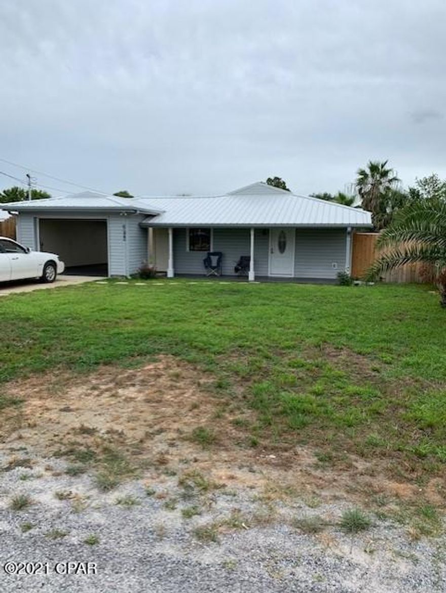 'CURRENTLY UNDER CONTRACT, SELLER ACCEPTING BACKUP OFFERS' 

Great Home, Great Location with Drive Through Garage! Pull your watercraft, trailer through the garage for easy storage in the grassy backyard. This well maintained home features a spacious master bedroom, bathroom, new carpet, and good storage. Okay for Short Term Rentals too! It's within walking distance to the Beach, Closest Beach Access- 13, Near Rick Seltzer Park (public parking allowed), several Public Boat Launches along Grand Lagoon and is close to St. Andrews State Park, Restaurants, Marinas, and more... 

All measurements are approximate and should be verified by the buyer.