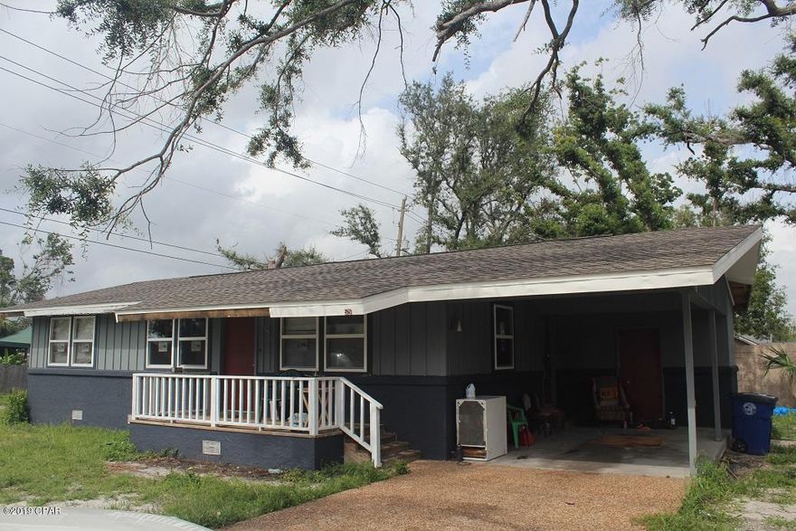 Large corner lot home with views of Watson Bayou.  Don't miss your opportunity to pick up this affordable home with new roof, new windows, new exterior paint, pine walls and wood floors.  Home needs a little work but would be great for first time home owner or rental portfolio.  There is a large 25x20 block detached garage in the rear that would be a great workshop or home office.