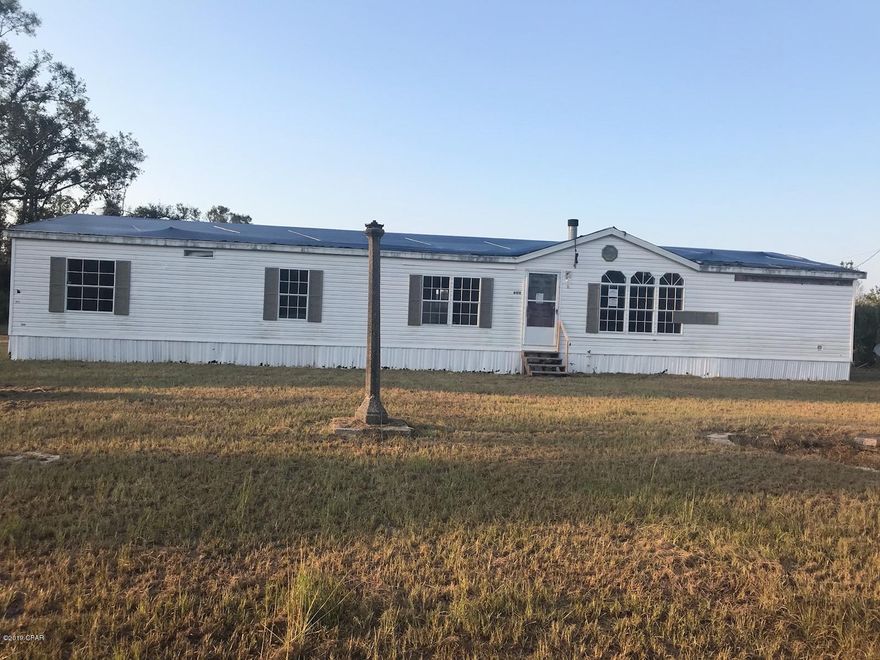 Perfect Country setting to build your new home!! 9.50 acres located in Greenwood. Mostly cleared and high and dry! Currently there is a 4 Bedroom 2 Bath DWMH with an office, but needs work to make livable. There is a well, septic and electric. Call today for your personal showing. This is Priced to SELL so call today!!