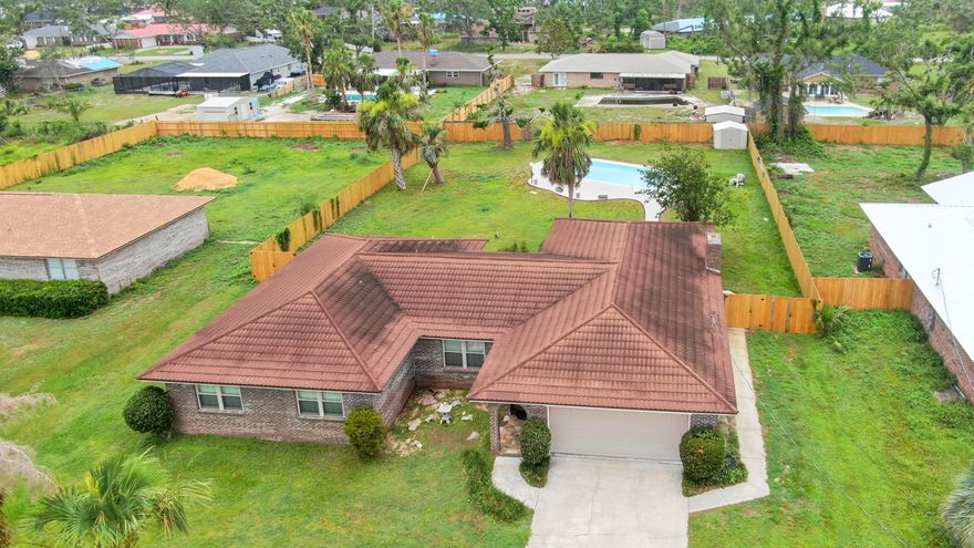 A home built to withstand a hurricane, and it DID! This ALL brick home has a Stone-Coated Metal Shake Roofing and Simonton impact-resistant windows that will withstand strong winds and flying debris. Spacious inside with 2,124 sqft, 4 bedrooms and 2 full baths, foyer, family room and kitchen living area with wood burning fireplace. New wood like tile throughout the house and all new paint. NEST thermostat is included :). The kitchen has been completely remodeled with all new cabinets, brand-new stainless-steel appliances, tiled backsplash, and beautiful light fixtures. The huge private backyard is fully fenced and has a 8ft deep in-ground pool and beautiful paved deck for loads of summer fun and sun! Cordless faux wood blinds in all windows. Call your REALTOR and go see it TODAY! All measurements and info are approximate, taken from BCPA, please verify if important. Simonton Coastal windows feature a heavy invisible plastic interlayer sandwiched between panes of the inner glass that prevents the puncturing of the glass from flying debris. During a severe storm or burglary attempt, the glass may shatter when struck, but it will not break out of its frame, so the home and its contents are protected.
Stone-coated metal shake roofing products are Class A fire-resistant, Class 4 impact-resistant, and provide a high-quality warranty performance that protects the roof in wind speeds of up to 120 mph.