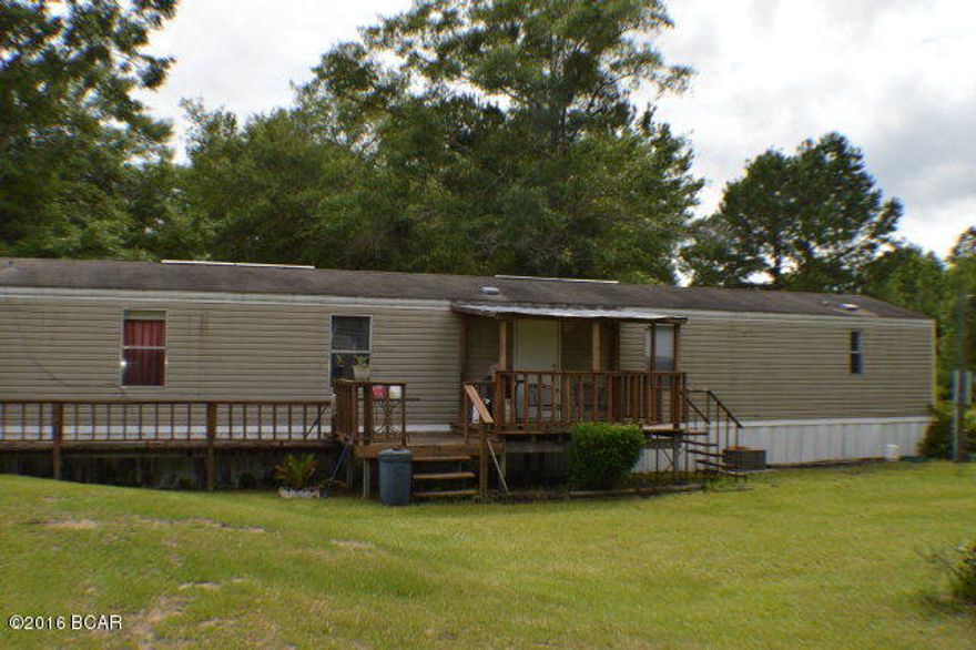 20.08 acres of both cleared pasture land for horses or cows with beautiful small Oak trees for shade. Property has well and septic tank and an out building to shelter tractor n lawn equipment. Mobile home is a spacious 2001 that is clean n well maintained with a back porch for relaxing in the afternoons. Yards are well maintained as well.