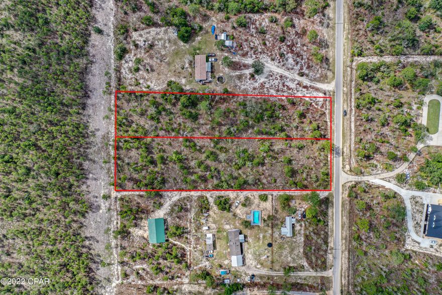 Looking for a large lot for your new home? Check out this high and dry, 1.51 acre parcel just off Hwy 77 on a private, paved road. Mobile homes are allowed. Buyer to verify all info and restrictions with County.