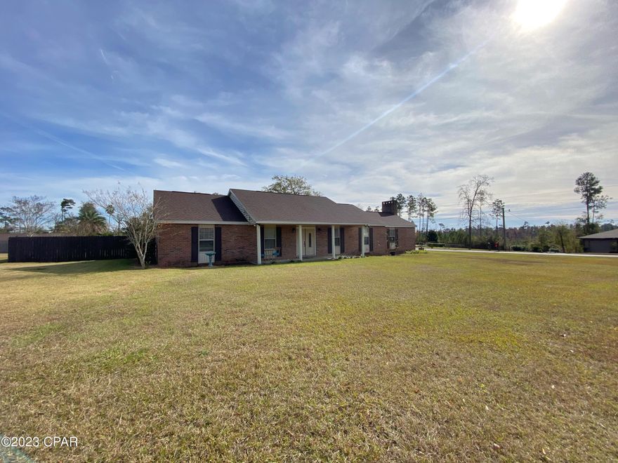 Welcome to your dream home in Marianna, Florida! This meticulously updated 3-bedroom, 2-bath haven is a masterpiece of comfort and style. As you step inside, you'll be greeted by stunning hard surface flooring that seamlessly flows throughout, featuring a perfect blend of elegant tile and warm laminate hardwood.

The heart of this home is its renovated kitchen. Adorned with gleaming granite counters and boasting a commercial-sized refrigerator, it opens gracefully to the dining area where a wood-burning fireplace sets the stage for cozy gatherings. 

But the allure doesn't stop there - a spacious family room awaits, complete with built-in bookshelves for your literary treasures. Imagine unwinding in this comfortable haven after a long day. In addition, a glassed sunroom offers breathtaking views of the inground saltwater pool, perfect for relaxing and entertaining year-round.

This home is more than just bedrooms; it's a versatile sanctuary. An additional living space invites creativity, serving equally well as a playroom, office, or potentially a 4th bedroom to suit your lifestyle needs.

Venture outside, and you'll discover a corner lot boasting a fully privacy-fenced backyard - a haven of tranquility. An inground saltwater pool, with 3 year old liner, offers a refreshing oasis in the Florida sun. The poolside atmosphere is further enhanced by two storage buildings, providing ample space for all your outdoor essentials.
The roof is only 5 years old, HVAC is 7 years old. Home conveys with all kitchen appliances and the washer and dryer, it will be ready for you to move right in!
