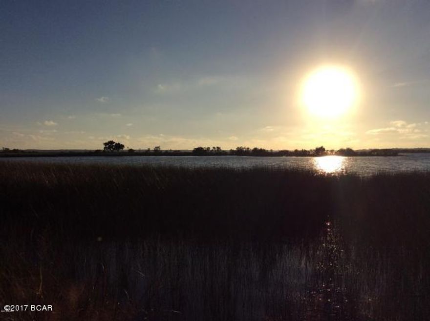 lot 159 is a Beautiful waterview lot in Laird Point.  This is a gated waterfront community located in East Bay County.  Well maintained subdivision.  Beautiful homes already built and this lot is just waiting for your dream home to be built.  Great opportunity to own a gorgeous lot with a fantastic sunset view over East Bay. All underground utilities and paved roads with ribbon curbing.  Please contact your agent for a tour of this great community today! Bank financing available