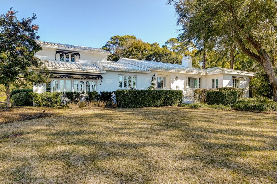 Beautiful architecture and stunning location overlooking St. Andrew's Bay located on Panama City's popular Beach Drive!  Home exhibits master craftsmanship throughout and has been painstakingly restored to its original grandeur with added modern updates.  Interior features hardwood flooring throughout, kitchen with Thermador range, gas grill and separate griddle, Viking Hood, Bosch Dishwasher, microwave, ice maker and wine cooler, formal living room with views of the bay and fireplace, sunroom with multiple water views, formal dining room, den, sitting room, master bedroom with huge closet, claw foot tube, separate shower,and double vanities, downstairs guest bedroom with bath, upstairs guest bedroom with bath, 4th bedroom/mother-in-laws over garage with bath and kitchen, walk-in basement with wine cellar.

Exterior features: .89 acres with extensive gardens and sitting areas, three car garage with additional storage, multiple patios, sprinkler system.
Other features:  15K Generator, well pump, new windows, wired for sound, security system.See PROPERTY DESCRIPTION form in Document section for specific details of home renovation and updates

Please click for full details of house, additional pictures and video!