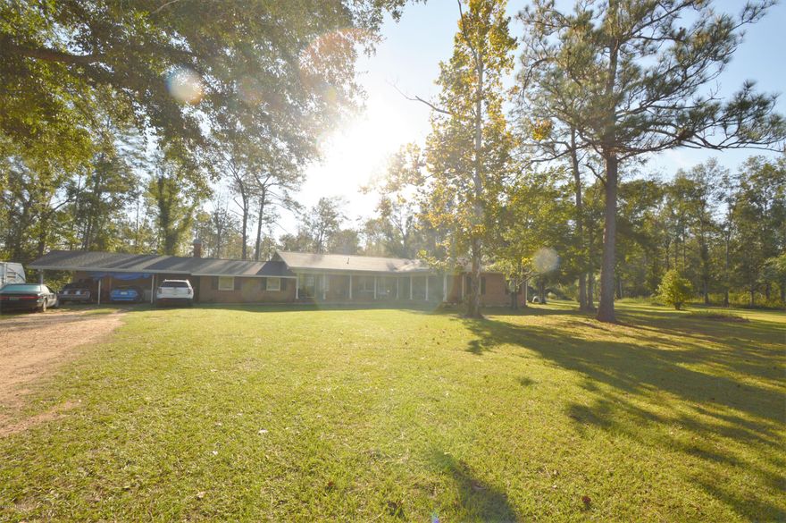 Looking for a Large home... minutes from down town. Three Bedroom, Three full bath with 1/2 bath off laundry. Sprawling brick  ranch sitting on 7.5 acres. Large spacious living space, formal dining, updated kitchen, Sitting room, Large den (fireplace has been capped)  with full bath. New roof in 2019.  Need some TLC.