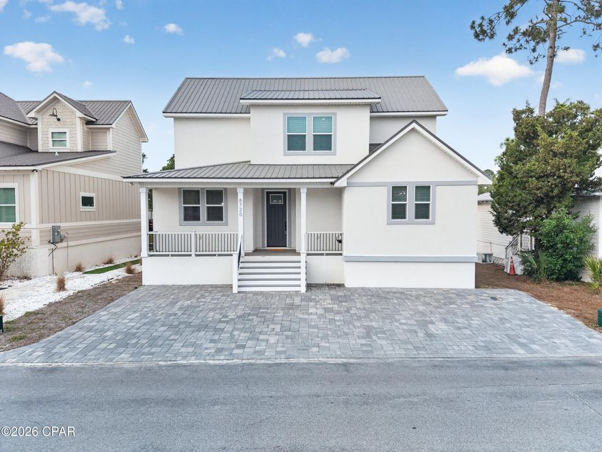As soon as you step into 6720 Harbor Blvd, you're immediately greeted by an abundance of natural light and serene canal views that set the tone for relaxed coastal living. This new construction home, built in 2023 and never lived in, offers a rare opportunity to own a fully furnished, turnkey residence in a private, gated Panama City Beach community with direct canal access leading to the Gulf.

The main living area is anchored by a beautiful electric fireplace with a custom mantle crafted from pecky cypress, adding warmth and character to the modern design. Thoughtfully designed and finished, the home blends comfort with elevated coastal style throughout.

The primary suite offers a peaceful retreat featuring a spa-like bathroom with a soaking tub, creating the perfect place to unwind after a day on the water. With four bedrooms and two-and-a-half bathrooms, the layout is both functional and inviting, ideal for full-time living or a luxury coastal getaway.

Residents enjoy exceptional community amenities including a relaxing pool and pickleball courts, all within a secure, gated setting. Whether boating from your backyard canal access or relaxing at home, this property delivers effortless waterfront living at its finest.