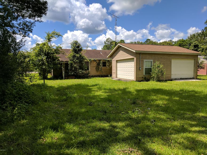 3 BED, 2 BATH CORNER LOT DIRECTLY ACROSS FROM ELEMENTARY SCHOOL, VERY NICE LARGE LOT. WITH A LARGE 20'X27' GARAGE ATTACHED. GARAGE HAS 2 ROLL UP DOORS, PERFECT FOR A SHOP OR EQUIPMENT STORAGE. SEPERATE LAUNDRY ROOM WITH CABINETS. VERY NICE HOME JUST NEEDS SOME TLC. THIS WILL MAKE SOMEONE A GREAT HOME IN A VERY NICE NEIGHBORHOOD. BEING SOLD AS IS/WHERE IS. BANK OWNED PROPERTY.