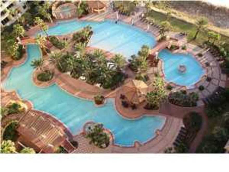 Never on a rental program, and you can tell. This is a gorgeous, fully furnished condo with tile throughout. The furniture is perfect, you can tell that it has not been on a rental program. It comes fully furnished (minus the big TV in the living room because it is not owned by the owner of the condo). The front loading washer and dryer convey as well. It is about as good as it gets in Shores of Panama.