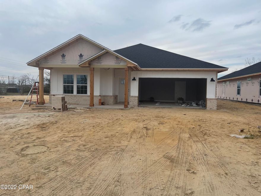 NEW CONSTRUCTION, built by George Outlaw Homes LLC. Kitchen with center island, custom cabinetry, quartz countertops, backsplash, walk-in pantry, & upgraded stainless steel appliances. Crown molding in great room, dining room, and kitchen. Great Room features tray ceiling. Enter your master bath through the beautiful barn style door, featuring a double vanity, garden tub, large, cultured marble shower & spacious walk-in closet.  Large, covered porch just off the Great Room makes this home perfect for entertaining. Vinyl plank waterproof flooring throughout. LED recessed lighting and upgraded fixtures. EXTERIOR-Home is 90% Brick, features a 2-car garage, yard will be fully sodded with sprinkler system. Measurements are approximate, if important to buyer please verify measurements.