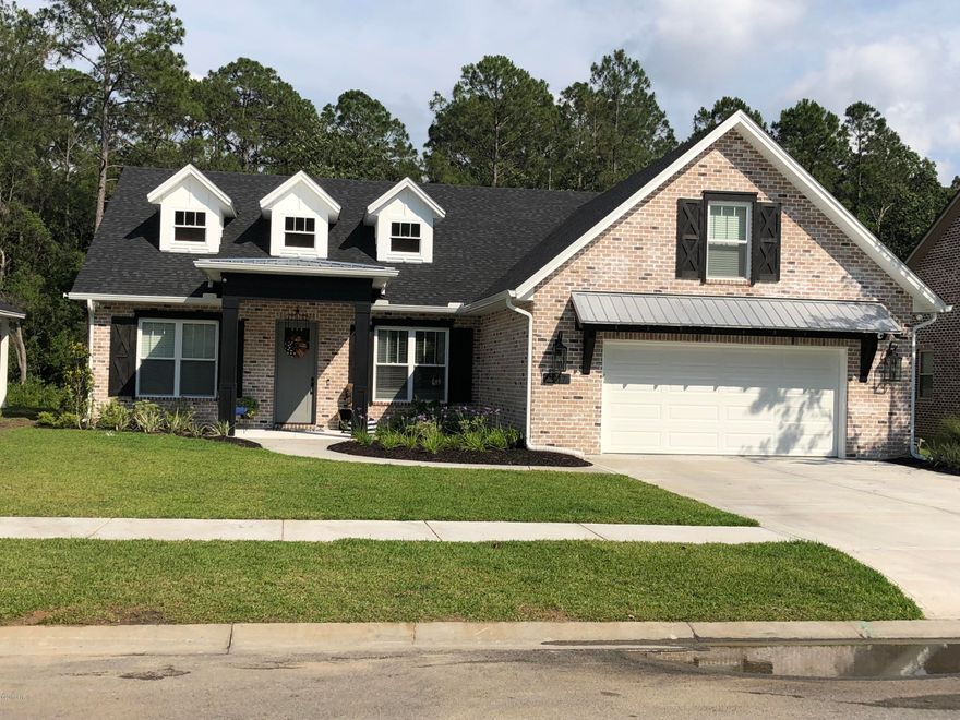 Exceptional, all brick, pool home in prestigious Hawk's Landing subdivision. This 5 bedroom 3.5 bath is just as beautiful inside as it is outside. Kitchen comes fully equipped with high end Jenn-Air appliances, custom cabinets and quarts countertops for a spectacular entertaining space that overlooks the great room. Coffer ceilings and shiplap in formal dining and tray ceiling in master bedroom. Escape to the master suite where you will find a jacuzzi tub, large walk in shower, dual sinks and laundry room right off of the master closet. Entire upstairs wing can be used as a mother-in-law suite, huge playroom and/or family room. Outdoor space features screened enclosure over the pool with plenty entertaining as well as yard. With crown molding throughout, this immaculate and professionally painted home is a must see. Furniture may be negotiated in sale. Pool enclosure was damaged in Hurricane and was completely rebuilt.