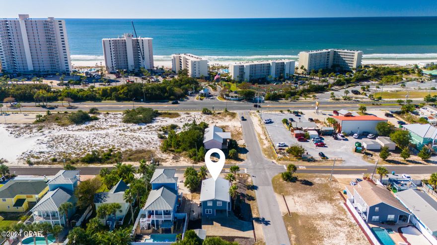 *Under contract, Seller will consider back up offers.* 

Location is EVERYTHING!  Located across Thomas Drive from the stunning Rick Seltzer Park. This popular public beach offers everything you need for a day in the sun, including restrooms, lifeguards, handicap-accessible mobi-mats, plentiful parking, and showers. Also, enjoy Finns Island Style Grub across the street from the home, where you can grab coffee, breakfast, or lunch.

This charming beach home boasts a versatile layout with 3 bedrooms and 3 full bathrooms, including a unique 1-bedroom, 1-bathroom lockout suite on the ground level. The suite features a kitchenette with a refrigerator, microwave, sink, and a cozy living area.  This lockout suite is perfect for guests, rentals, or multi-generational living.

Head upstairs to find an oversized wraparound deck with slider doors that welcome you into the open-concept living, dining and kitchen space. This level also includes 2 spacious bedrooms, 2 full bathrooms, and a convenient laundry room, making it a functional and stylish space for everyday living and entertaining.

This corner lot has two driveways and covered parking adding convenience and flexibility, while the fenced-in side yard includes a sprinkler system and provides space for outdoor activities. A storage shed with power offers a practical solution for tools, beach gear, or hobbies.

The rear of the property offers ample space for a pool or future expansion, making this property a smart investment. With hardie board siding, durable vinyl plank flooring, and thoughtful features like the lockout suite, this home is ready to cater to any lifestyle. Whether you're looking for a primary residence, vacation getaway, or an income-producing property, the opportunities here are endless!