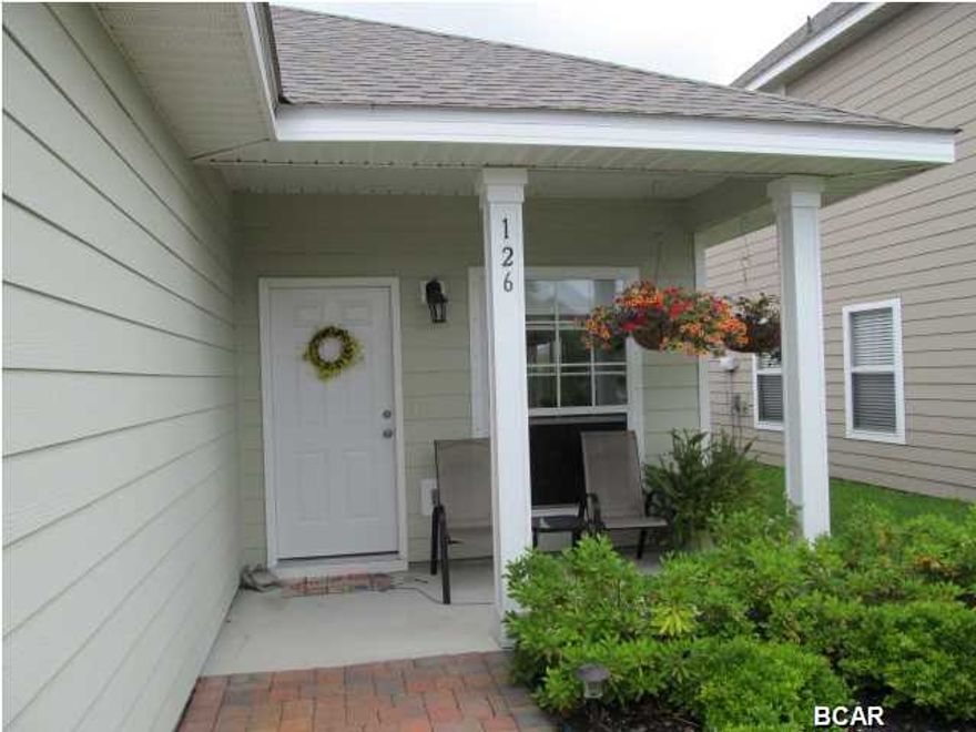 Lovely, well-maintained 3 bedroom, 2 bath home with covered porch,  2 car garage and patio in Wild Heron. All Appliances are stainless and black- Humidifier &  full size washer and dryer included. flooring is tile and carpet.