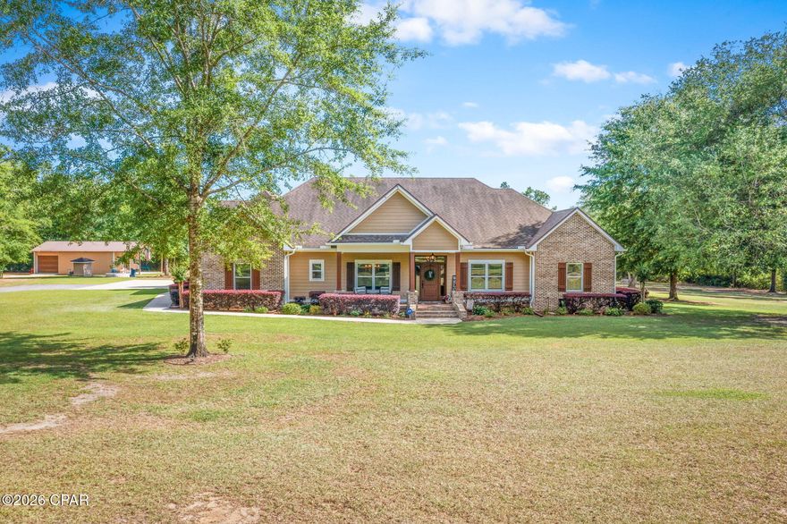 Tucked away on 10 private acres in the desirable Gainer Road area, this custom-built home offers space, privacy, and timeless design. With 5 bedrooms and 3.5 baths spanning over 3,300 sq. ft., the layout is ideal for both everyday living and entertaining. From the moment you arrive, the property makes a lasting impression with a beautiful wood fence, cold mix asphalt driveway, and a concrete walkway leading to the inviting covered front porch--perfect for enjoying the peaceful surroundings. Inside, you'll find a welcoming interior featuring raised ceilings throughout the home, adding to the open and airy feel. The space is further highlighted by a formal dining room with coffered ceilings, hardwood flooring throughout the main level, and detailed trim work that adds character throughout. The living room serves as the heart of the home, featuring built-ins, a gas fireplace, and a raised trey ceiling. The kitchen is thoughtfully designed with custom cabinetry, granite countertops, double wall ovens, cooktop, center island, breakfast bar, and a walk-in pantry--perfect for gathering and hosting. The spacious primary suite offers a comfortable retreat with double vanities, granite countertops, tiled shower, soaking tub, and an oversized walk-in closet. Two of the additional bedrooms are connected by a convenient Jack-and-Jill bathroom, while another bedroom is currently being used as an office/gym--offering flexibility to suit your needs. An additional bedroom is located upstairs with its own full bath, creating the perfect private space for guests or a quiet retreat. Step out to the spacious screened porch, complete with a fireplace, providing an ideal setting for year-round outdoor living. The property also features a 48x24 barn with a roll-up door, irrigation system, fire pit, and plenty of room to enjoy the full 10 acres. Added features such as a whole-home generator, water softener, and alarm system offer comfort, efficiency, and peace of mind--making this property the perfect blend of country living and modern convenience.
