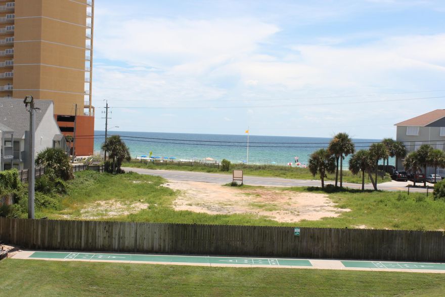 Just reduced! Need EASY BEACH ACCESS without paying a fortune??? We've got you covered! This gorgeous two bedroom, two bath condo is only steps away from the beautiful white sandy beaches of the Emerald Coast! Located DIRECTLY across the street from Public Beach Access #73, you are literally only steps from the beach! The open floor plan of this condo is a split bedroom design and very well equipped. Enjoy the tiled flooring throughout the living area, kitchen and bathrooms and practically new carpeting in the bedrooms. This condo has only had one owner and has never been a rental, so it really feels brand new! It also has the largest front window configuration available in Peachtree, which offers an extra large front porch area as well as excellent GULF VIEWS. Enjoy your coffee on your large front porch or the peace & quiet of the wooded conservation area from your rear patio. Phase 1 of Peachtree Place boasts a community pool and extremely easy beach access all at a price you can afford. Call today to see this gem!