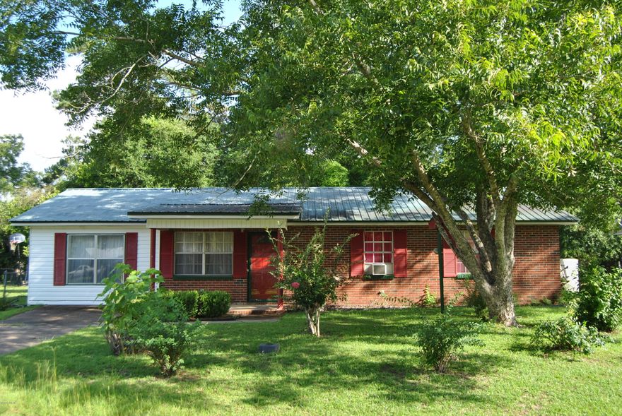 Nice home on a lovely lot...convenient to town.  Home has a metal roof and would make a great starter or rental...