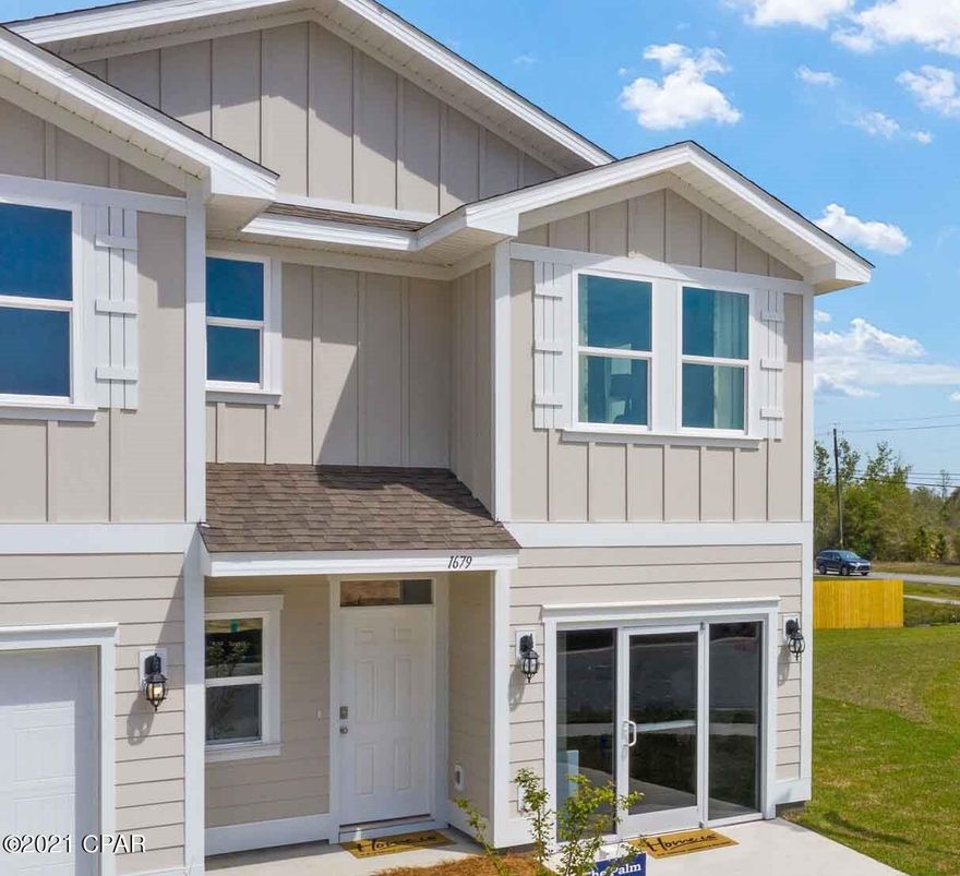 The Palm floor plan is a 3 bedroom, 2.5 bath townhome. As you enter, the long entry leads to an open living and dining area. The kitchen has a breakfast bar and is an open concept. This plan features a single car garage and all bedrooms are on the second level. Bedroom 1 has a large bath with walk-in shower and glass door as well as a walk-in closet. The additional bedrooms are situated at the back of the townhome as well as a full bath and laundry area. This is our newest townhome community and it is centrally located in Lynn Haven. This community is close in proximity to schools, shopping and dining. Enjoy the convenience of having a central mail box station, street lights throughout the community and extended driveways. This home comes standard with a Smart Home Technology package which includes a KwikSet keyless entry, Skybell doorbell, automated front porch lighting, an Echo Dot device, and Quolsys touch panel which can be integrated to control your lighting, thermostat, front door and so much more. 

This home is being constructed with the Zip Sheathing system, providing greater protection than a traditional housewrap from damages due to wind, rain, and extreme weather. A builder 10-year structural warranty is also included.

Pictures may be of similar, but not necessarily of subject property, including exterior and interior colors.