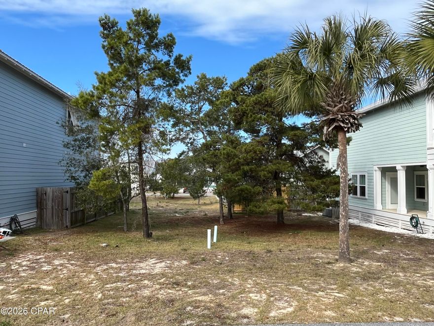Don't miss the opportunity to build your dream beach home in the non-short-term rental community of Paradise Grove. This cleared, build-ready lot is located in a charming neighborhood of cottage style homes with covenants and restrictions, including a two year build-out requirement, preserving community value. Paradise Grove offers a gated entrance, well-maintained common areas, and a community pool. Ideally situated on the west end of Panama City Beach, just minutes from Pier Park, a short drive to 30A and the airport, and only four blocks from the beach. An excellent opportunity to create your own coastal retreat.