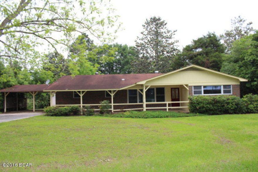 PRICE REDUCED!! Neat home in town! This home is in a very nice location with easy access to all local amenities. It has nice features that include a large living room, kitchen with stove, double ovens, dishwasher and a breakfast bar. The dining room looks over the fenced backyard. The master bedorom has master bath and there are 2 other nice size bedrooms plus a second bath. It has an attached 2 car carport. There is a covered front porch and a covered back porch. A great feature is a large detached workshop.