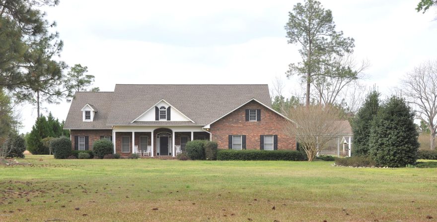 **Reduced**Comfortable elegance coupled with modern day amenities and nostalgic finishes makes this home a MUST SEE. Nestled on 5 acres this spacious floor plan boast a large great room that could serve as a second master suite, formal dining, living room with trey ceiling, built-in shelving, fireplace and hardwood flooring, large eat-in kitchen with granite countertops, stainless steel appliances and fresh paint. Master suite features trey ceiling, large walk-in closet, marble tub, separate shower and double vanity. Additional spacious bedrooms feature jack-n-jill bath with separate laboratories and sinks. Outside features include a attached carport, 28X20 detached workshop, long circular driveway and pristine landscaping. Additional land could be purchased.