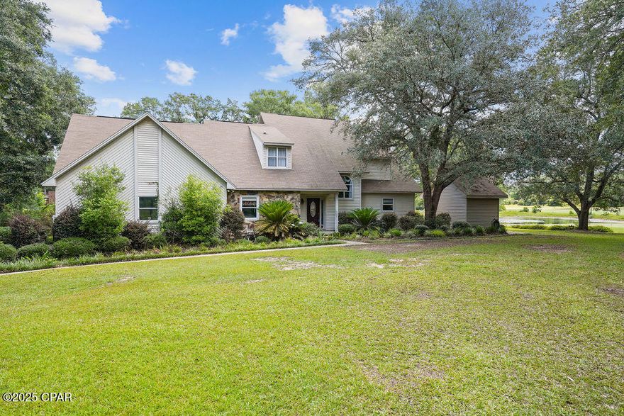 Welcome to 2661 Fairway Drive in Bonifay - a stunning home located on a spacious double lot totaling 1.87 acres in the desirable Dogwood Lakes community. This beautiful property offers waterfront living with peaceful pond views, a sparkling in-ground pool, and multiple outbuildings that provide added storage or workspace. The home can easily function as a 4-bedroom, 2.5-bath layout to suit your needs. Inside, the main level boasts a large, open-concept floor plan perfect for entertaining, with the dining area flowing seamlessly into the living room under vaulted ceilings that enhance the sense of space. The master suite includes an adjoining room that could serve as a fourth bedroom, nursery, home office, gym, or flex space. Whether you're relaxing by the pool, enjoying the water views, or working on projects in the outbuildings, this property truly has it all.