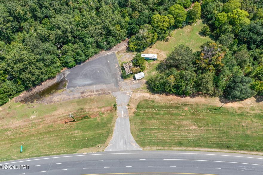 Discover the potential of this expansive 2.93± acre commercial property, perfectly positioned at a highly visible and easily accessible corner of Hwy 231 and 73. With an AADT (annual average daily traffic count) of 12,200 (2023 DOT data) you can take advantage of the high-traffic intersection and excellent road frontage these parcels bring to your business. While the existing buildings hold no contributory value, the true asset lies in the prime location and generous lot size, offering ample space for redevelopment.