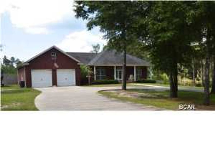 This beautiful brick home in Cedar Creek Chase (one of the areas quietest and most beautiful subdivisions) is set on a hill that overlooks a pond and is shaded by huge pine trees overlooking a freshwater feeder lake of Cedar Creek. A split bedroom 3/2 is simply gorgeous inside and out. High ceilings, granite counter tops, laminate wood floors, carpeting and exceptional trim work make this home stand out! Take a luxurious whirlpool bath or drench yourself from the rain head in the Master Bath! Two large walk-in Jack & Jill closet add to the storage in the Master bedroom. Granite counter tops for the Breakfast bar and Kitchen island. A large, double carriage door garage, fully insulated with an additional utility vehicle door, painted with crown molding... accessed by an ample