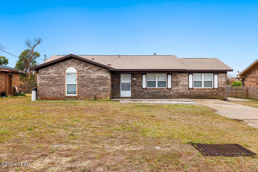 CURRENTLY UNDER CONTRACT, SELLER WILL CONSIDER BACKUP OFFERS Discover the allure of this beautiful 3-bedroom, 2-bathroom all-brick home, boasting over 1,400 sqft of comfortable living space. Nestled conveniently near schools, shopping, dining, beaches, and Tyndall Air Force Base, this residence offers a blend of convenience and charm. The roof was replaced in 2019, and the interior features tile floors, updated light fixtures, and a spacious kitchen adorned with granite countertops, stainless steel appliances, and a breakfast bar. Relax on the covered back porch overlooking a generous backyard with a storage building. The master bedroom offers ample space, and its updated bathroom showcases a tiled shower, granite countertops, and modern fixtures. Two additional rooms provide plenty of accommodation for family and guests, with an updated guest bathroom featuring a new vanity and tiled shower. This home combines modern amenities with a touch of elegance, featuring a formal dining room and a full-size laundry room for added convenience. Don't miss the chance to make this property your new home - schedule a viewing today!