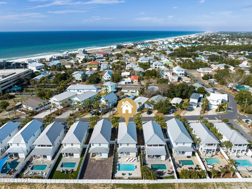 Welcome to your coastal paradise! This stunning 4-bedroom, 3.5-bathroom home offers Gulf views from the front porch! Providing the perfect backdrop for coffee to start your day, or cocktails to end your day in paradise. Step into this beautifully sophisticated coastal home with highly curated elevated designs inside and out. This home offers stunning interiors and exteriors. Owner is an interior decorator! Just steps away from the emerald waters of the Gulf of Mexico and beach access 74. Upon entering the home, 10 foot ceilings on the main level welcome you. Built in 2019, this 2-story custom built home, is the ideal beach house with exquisite high end finishes, a grand living area and dining room and 2 masters, one on the main level and one upstairs.
Spa like bathrooms with master on main shower offering oversized 4 x 6 shower with frameless glass. 2 bathrooms on main level. This home has been a primary residence that has not been rented, but has a potential rental income of $150k annual. The kitchen offers impressive solid wood shaker 42 inch cabinets, quartz countertops, marble backsplash and large island. Oversized pantry with lots of storage. High end Samsung stainless steel appliances with new dishwasher.

Experience the beauty of the Gulf of Mexico from the comfort of your own home. Outdoors, you'll find your backyard oasis! Jump into your large saltwater pool outfitted with LED lights, a waterfall, variable speed pool pump and large travertine pool deck. Outdoor shower, plush landscaping, irrigation with privacy fence. Backyard backs up to a nature preserve that offers a relaxing oasis. The nature preserve with never be built on offering peace and quiet. With additional heated and cooled owners closet off the back porch for plenty of storage.

Metal roof, hurricane impact windows. Low utilities. Low HOA . $27.00 per month. Termite bond in place that is fully transferable.

Located in Panama City Beach, FL, this home offers convenient access to the area's best attractions, including pristine beaches, championship golf courses, world-class dining, shopping, and entertainment options. 2.6 miles to Pier Park, 7.2 miles to 30A Rosemary Beach and 30 Avenue. A short stroll or bike ride to great restaurants, shopping and entertainment: Thomas Donut and Snack Shop, Carousel Grocery, Mikes Oyster Restaurant and Sandpiper Tiki Bar. Brand new hospital currently being built on Highway 79.