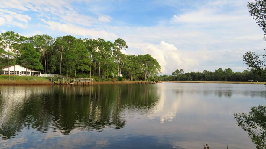 Cook Bayou WATER FRONT property EXTRAORDINAIRE! A MUST SEE home located on a 0.86 acre nicely elevated lot. This home was completely renovated in 2016. Clean lines and beautiful materials  create a peaceful, calming atmosphere that will embrace you as soon as you step into the foyer. The living room features a lime stone wall with huge picture window that frames a stunning view of bayou & back yard. You will enjoy preparing meals in the well appointed kitchen and the open floor plan allows for easy interaction with family and guests. The main bedroom is a beautiful retreat with 3 closets and the adjoining bathroom is a contemporary oasis with custom shower. The standing seam metal roof is less than 2 years old. RV/boat parking next to the house and also in the 26x36 SHOP! NOT A DRIVE-BY!