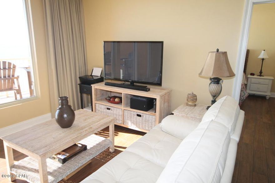 This complex has perhaps the best view on the beach. From your balcony you can see the entire beach. This immaculate unit is expertly decorated and is a must see unit. The unit has many upgrades including all tile floors.  The complex is well managed with some of the lowest HOA fees on the beach. In walking distance to fine restaurants and beach clubs.