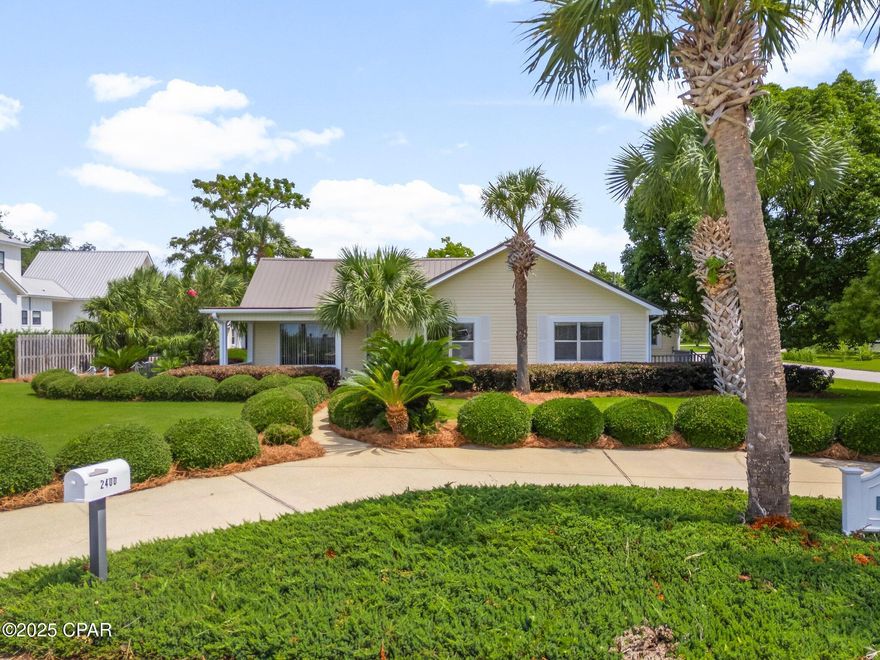 CURRENTLY UNDER CONTRACT, SELLER WILL CONSIDER BACKUP OFFERS. Don't miss this rare opportunity to own a beautifully maintained 3-bedroom, 2.5-bath home located directly across from St. Andrews Bay, with its own private dock and sweeping views of Shell Island.
This spacious home features open main living quarters filled with natural light, ideal for both everyday living and entertaining. The master bedroom offers a private bath and its own patio, while two additional bedrooms provide room for family or guests.
Enjoy the coastal breeze from the covered front porch or take in the bay and Shell Island views from a second side patio, perfect for morning coffee or evening gatherings. The fenced backyard includes a detached workshop—great for hobbies or storage.
Situated on a neatly landscaped lot, this home has great curb appeal and space to relax or entertain. The private dock across the street gives you direct access to boating, kayaking, or fishing right from your doorstep. 
This is more than a home—it's a lifestyle. With incredible views, water access, and a vibrant neighborhood just steps away, this property is a true coastal gem. Schedule your showing today and experience the beauty of St. Andrews Bay living!
All measurements are approximate.