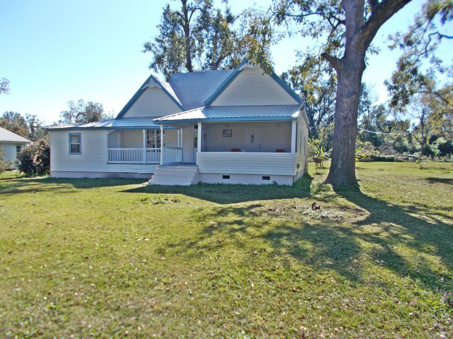 Very  nicely restored home in town, large open rooms with 10 ft ceiling, Large living room,4 bedrooms 2 bath, all updated and looks and shows very nice, all in the city limits, large corner lot, with some nice shade trees, there is  a large open front porch for afternoons visits and two other screened porches.  Easy to show.
