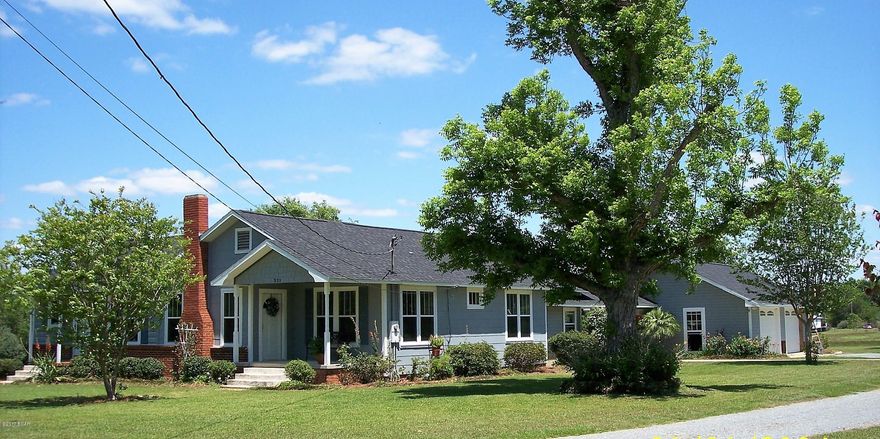 Well cared for country home on approx 10 acres planted in permanent hay pasture. 

A stocked pond has a bridge across for ease of fishing. There is a beautiful pool and summer kitchen for leisure time.

Home has custom cabinets in kitchen and master bath, tile and engineered hardwood floors except the mudroom has a brick floor. This room also serves as a sun room and laundry room with split air unit. New updates include windows, architectural roof, heating & cooling, septic system, well & pump. There is a 2-car garage attached with covered walk to the home. Yard has four large pecan trees that have been pruned, is landscaped with a garden. Large barn with shop.