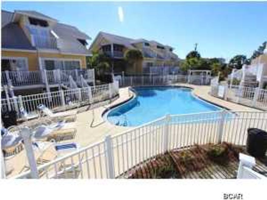 Just listed is an immaculate, never before rented oversized 2BR townhouse on the beachside of Hwy 98 in Mexico Beach. With multiple decks, storage, and a covered garage, these are the largest 2BR townhouses or condos in Mexico Beach with 1,922 total sq ft. Oceanside Village is a very desirable and well laid out townhouse development located steps to the beach, pier, Mexico Beach Marina, Tommy T's, Shell Shack and 40th St. Pizzeria. The layout is very spacious and provides comfortable sleeping for 10. The open kitchen/dining/living area flow well and open up to the deck overlooking one of the nicest pool areas in Mexico Beach. The master bedroom/bath is very roomy and has a private Gulf view deck. This home is well furnished & equipped & includes everything with the exception of a
