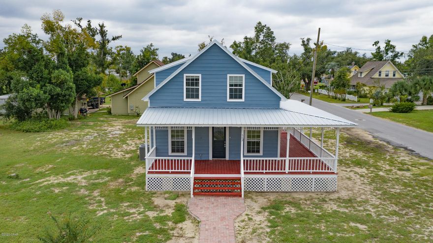 'UNDER CONTRACT ACCEPTING BACK UP OFFERS'. This beautiful home offers a combination of modern day attributes with early Lynn Haven historical character just steps from Anderson Bayou. Gorgeous wrap-around porch with views of the water and multiple entry access. This home was carefully relocated from its orginal location and updated, improved and renovated for today's world! NEW foundation, roof, siding, kitchen appliances, bathroom amenities, flooring, paint, plumbing, electrical panel/breakers and more.  Master bedroom and bath are upstairs and very spacious with an en suite and enough square footage for an office or sitting area. Convenient to everything that Lynn Haven has to offer with shopping, dining, schools and more.