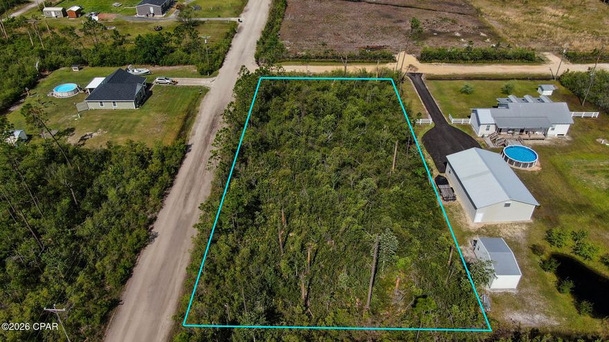 Property is raw land, uncleared. It's a 1 acre corner lot with electrical service at the street. The property has no mailing address. Next door neighbor address is 2201 BJ Drive.  Buyer should verify all zoning, measurements and land uses plus all other information deemed important.  Property is in a flood zone.