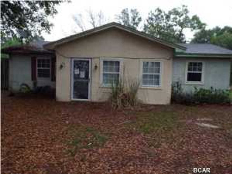 Great Bargain.  Starter block 3 bedrooms, 2 baths home needing some TLC, on an acre of land off a private dirt road offered as is. All sizes are approximate please verify accordingly.