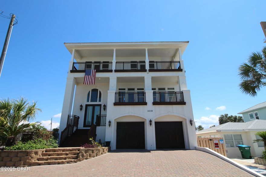 Experience resort-style living in this move-in ready, luxury coastal home—just steps from the beach! This custom-built property features 5 large bedrooms, 4 full baths, 2 fully-equipped kitchens, and an attached 2-car garage, perfect for multi-generational living or hosting guests. Enjoy 10-foot ceilings and elegant crown molding throughout, two expansive porches with panoramic Gulf views, and a private heated and cooled pool for year-round enjoyment. Light-filled, open-concept living spaces and high-impact, storm-resistant construction on pilings offer comfort, safety, and durability. Seller is highly motivated—don't miss this exceptional opportunity for immediate occupancy and premium beach living!