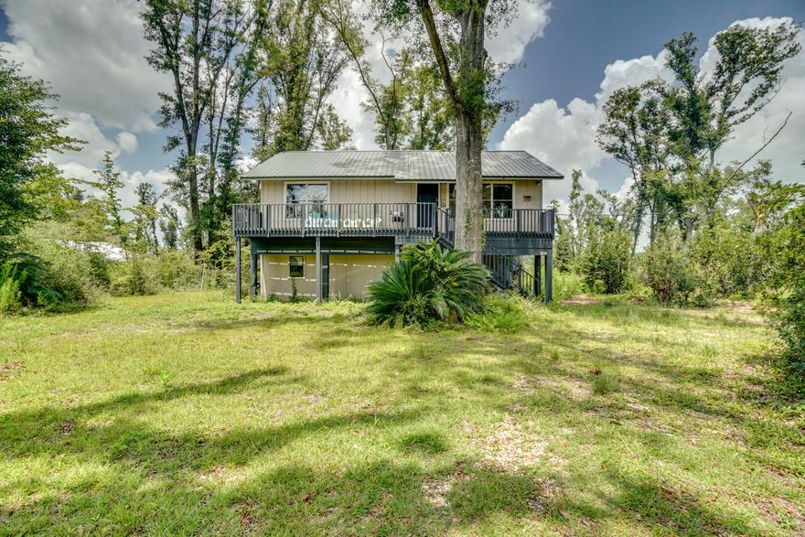 **CURRENTLY UNDER CONTRACT, SELLER ACCEPTING BACKUP OFFERS**This two bedroom, two bath getaway bungalow is a one of a kind gem located in the heart of Compass Lake in the Hills. Situated in a retreat like atmosphere, this property features a landscape of gorgeous oak trees, fire pit and sitting area. This charming home's interior is fully appointed with the finest of finishes featuring an open floor plan with updated kitchen and modern appliances, updated bathrooms and vanities, wood laminate flooring throughout the main level, and a massive home theatre room! Come check out this spectacular community with lake access, boat rentals, bike rental, driving range, disc golf course, tennis courts, and private pool!