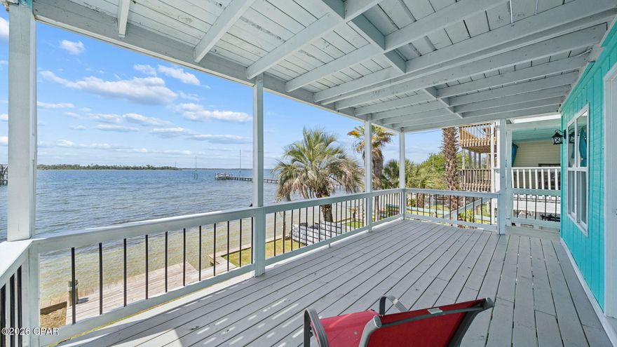 One of the best-priced bayfront properties with direct Gulf access in Bay County, this beautifully updated three-story East Bay townhome delivers deep-water access, stunning views, and exceptional versatility--including a fully independent 1 bed / 1 bath ground-floor apartment. Whether you're seeking a primary residence, second home, VRBO/Airbnb investment, or a live-upstairs/rent-downstairs setup, this property checks every box. NO HOA. 
SHORT TERM RENTAL ARE ALLOWED!

Located just 5.5 miles from Tyndall AFB and minutes from Sacred Heart Hospital, this home offers convenience paired with true Old Florida charm. The exposed beam ceilings create a warm, heritage feel, while numerous modern upgrades make the home move-in ready. Recent improvements include a brand-new seawall, new porch decking, new fencing, new windows on the 3rd floor and master suite, new LVP flooring, new cabinets with quartz countertops, new bathroom tile, a newer metal roof, a 5-year-old HVAC, and a 3-year-old water heater.

Step inside the main level and enjoy a spacious great room and kitchen that open to a 22' x 10' covered waterfront balcony--perfect for hosting, relaxing, and taking in the breathtaking sunsets over East Bay. The middle level features the master suite with its own private 22' x 10' balcony, offering peaceful sunrise and sunset views. This floor also includes a large guest bedroom capable of accommodating two beds, along with a full guest bath.

The ground-floor apartment is a standout feature: a complete 1 bed / 1 bath unit with full kitchen, separate entrance, and its own A/C. It functions as a true lockout unit, ideal for rental income, guests, or multigenerational living. The occupant can enter through the backyard and walk around the side of the home to their vehicle without accessing the main residence.

Every floor of this home offers beautiful bay views. Step outside to your private beach with seawall, just steps from your door. Ownership also includes 1/11 interest in the 90+ ft ''Pitts Row'' dock, where you can park your boat, jet skis, or other watercraft--or build your own private dock if desired. With deep water and easy access to East Bay, Shell Island, and the Gulf of Mexico, this is a boater's dream.

This rare waterfront opportunity blends charm, upgrades, income potential, and unbeatable access to the Gulf. Schedule your showing today and experience the best of East Bay​​‌​​​​‌​‌​​​​‌​​‌​​​​‌‌ living.