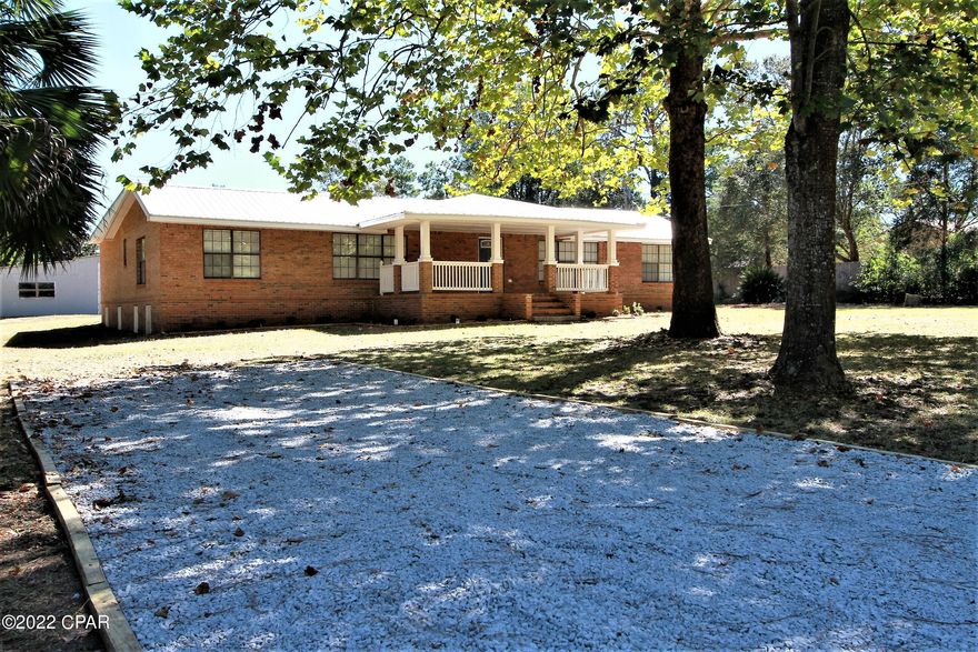 Beautifully RENOVATED BRICK HOME ON 1 ACRE PARCEL WITH 5 CAR DETACHED GARAGE, CARPORT & GREEN HOUSE. Green house can be a CHICKEN COOP. Brand New Metal Roof on Home and Green house. Large Covered Front Porch to catch the Florida Breezes. Beautiful Maple Tree in front yard along with various trees but mostly cleared and level. Home Boasts an Open concept Living room that leads into the Beautifully renovated kitchen and dining room. Kitchen has quartz Counter Tops with backsplash, plenty of cabinet space and Brand-New Stainless-Steel appliances. 4 Bed 2 Bath with Large Master Suite and Large Master Bath. Separate Soaking Tub, walk in shower along with His and Her sinks. Plenty of closet space that feature walk in closets and Barn doors. Other Bedroom sizes are roomy all with nice closet space per room all with Barn Doors. Tasteful Paint with all New Trim and doors. New Light fixtures and ceiling fans. Brand New AC and Water Heater. Large Laundry Room off the Kitchen with back door that leads to the Detached Garage that has both 110 and 220 Amperage outlets, Great workshop! New Landscaping was just finished to spruce it up along with a Driveway for extra parking. Build in 1950 with a crawl space but County has deemed it's Effective Date of 2014. Crawl space Sub floor was Completely replaced with All New Footers and plywood as well as Roof Truss Braces. Brand New Electrical and Plumbing as well. Come to the Country and enjoy this Beautiful home! Crestview just a short distance to all it has to offer. Set up your showing today!