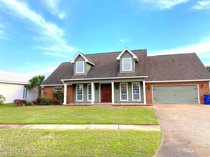 NEW ROOF JUST INSTALLED!!What a beautiful house and did you see that pool and patio kitchen area? That is what you will be saying after viewing this luxurious home located in the middle of one of the most prestigious locations in Panama City. This 5 bedroom, 2.5 bath brick structure boasts one of the most beautiful wood floors you have ever laid your eyes upon. The entry way with its decorative solid wood door, concrete porch and wooden columns immediately make you feel secure and at peace after a long days work. Upon stepping inside the home a parlor, the chandelier and formal dining area let you know this is not your everyday, run of the mill structure. Decorative trim, crown moulding and chair rail adorn the walls while the wooden banister will help you find you way upstairs. high end, solid surface counter tops that never need to be sealed. Multiple large windows provide all the light you will ever need during the day and pendant lighting will fulfill that duty during the night. The main living area have the hardwood floors continued throughout and for those chilly nights a fireplace will keep you warm and cozy. The master bedroom is large with two walk in closets and an en suite featuring a glass and tile shower, Jacuzzi tub and two separate vanities. Upstairs you will find four additional bedrooms and a full bath. There are storage closets abound and some feature attic access for extra storage. After touring the house you will exit into a backyard paradise with a large kidney shaped pool, textured patio, outdoor kitchen, palms, ivy and beautiful grass that fill an extraordinarily large area that is surrounded by a privacy fence. Call today before your dream home becomes a missed opportunity.