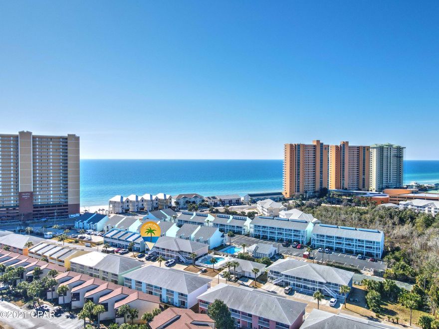 So close to the ocean, drive up to your condo, unload the car and take the few steps to your front door on the GROUND floor! Walk across the street and you have miles of beach to enjoy!  If you want to relax, enjoy your large covered porch on the front or one of  two back porches.  A dip in the clean pool is convenient since it is right next to the ''I'' Building or there is a building with card tables as well as shuffleboard for the friendly community to enjoy. Pets on leashes are fine for owners. Restaurants and shopping are close by at Pier Park.

Water, sewer, trash, cable, wi-fi, pest control and insurance on building & common areas are all included in the HOA fees- There is so much to do in PCB- swim with dolphins, visit the sports parks, shop or dine in great restaurants.  ENJOY!