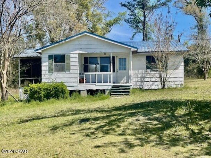 Wonderful investment property!  This cottage is in town with city water and sewer.  It has a formal living room, dining room and 3 bedrooms, one of which is being used as a utility room.  A metal outbuilding is included. Metal roof installed in 2015.   With a few repairs you will be set to use as rental property or a permanent residence.  The lot is at end of cul de sac offering some privacy.