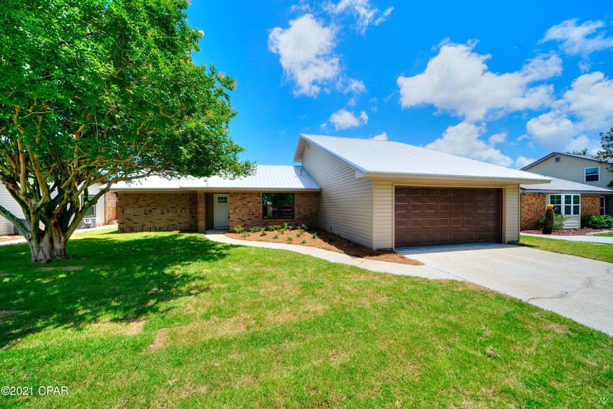 Completely remodeled 4 bed, 2 bath home located in the desired Boat Race Estates community.  This home welcomes you into a spacious living area with an open concept kitchen and dining room, offering a grand space to host family and friends without missing a beat.  The kitchen will wow you with a brand new island boasting quarts countertops, a breakfast bar, a stove/oven and microwave built-in. The kitchen also features a tiled modern backsplash, stainless steel appliances, a pantry and white shaker cabinets. The spacious master bedroom is located on the main floor and boasts a large walk-in closet as well as its own private ensuite.  The master bathroom is equipped with a beautiful surround tile walk-in shower, a modern vanity with quarts countertops and a linen closet. Two additional bedrooms are also located on the main floor and share a full bathroom with a shower/tub combo and a quarts countertop vanity. The large room upstairs has a closet and can also be used as an office space or game room. The living area leads to the beautifully landscaped backyard with a privacy fence all around. This backyard is the perfect place to enjoy the Florida sun with family and friends. Everything in this beautiful, move-in ready home is brand new including the roof, electrical, plumbing, lighting, flooring, irrigation, sod and more. The HVAC is 2017 and all the ductwork is brand new in 2021. This home is located near a plethora of restaurants, shopping centers, and parks for the ultimate convenience.